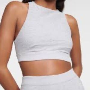 ALO Yoga Light Pink Crop Workout Top- shown on model in white